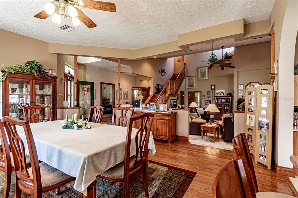 9215 Ridge Road New Port Richey, FL 34654 - Photo 26 of 71 a view of a dining room with furniture