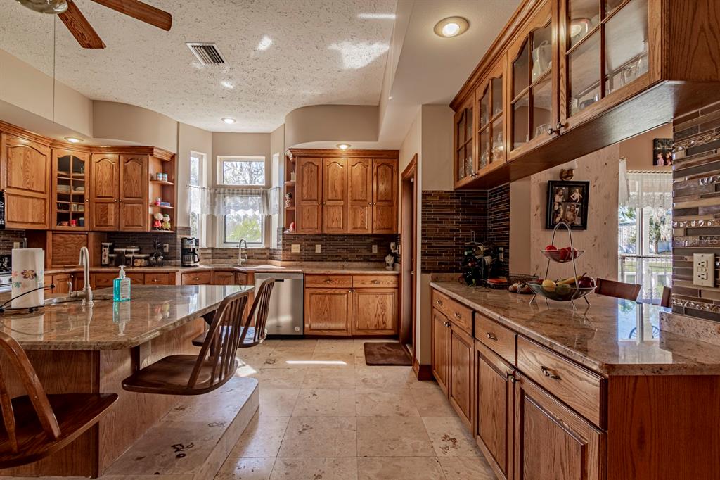 9215 Ridge Road New Port Richey, FL 34654 - Photo 28 of 71 a kitchen with lots of counter top space
