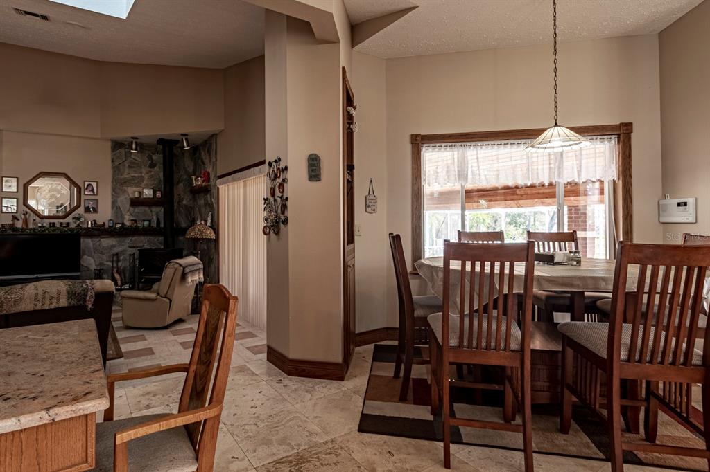 9215 Ridge Road New Port Richey, FL 34654 - Photo 33 of 71 a view of a dining room with furniture