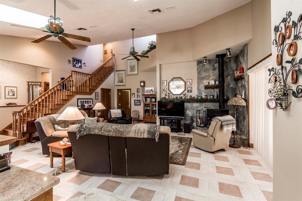 9215 Ridge Road New Port Richey, FL 34654 - Photo 35 of 71 a living room with furniture and a clock