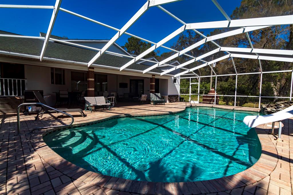 9215 Ridge Road New Port Richey, FL 34654 - Photo 5 of 71 a view of a backyard with sitting area