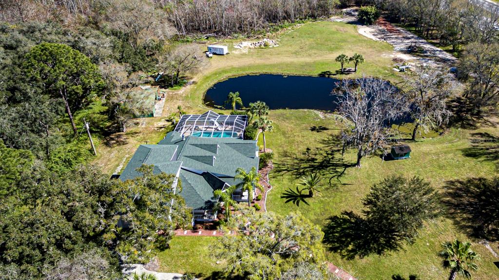 9215 Ridge Road New Port Richey, FL 34654 - Photo 57 of 71 a view of swimming pool with a yard