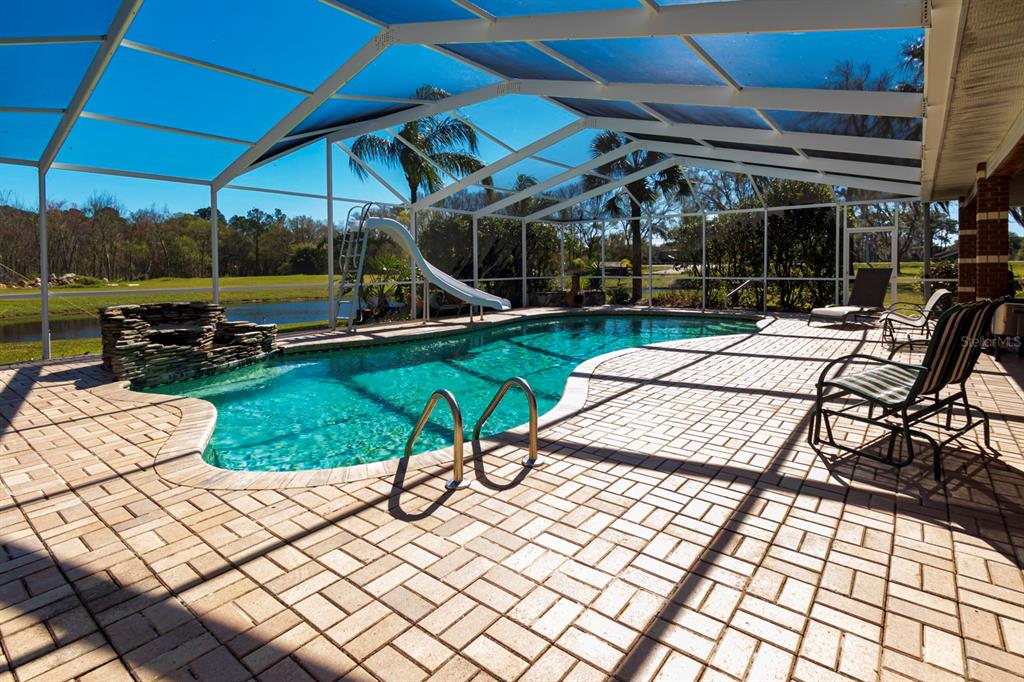 9215 Ridge Road New Port Richey, FL 34654 - Photo 6 of 71 a view of a backyard with sitting area