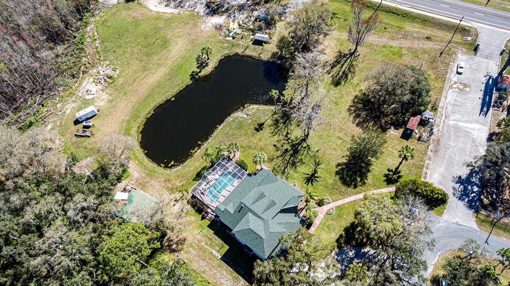 9215 Ridge Road New Port Richey, FL 34654 - Photo 62 of 71 an aerial view of a house with a yard and mountain view in back