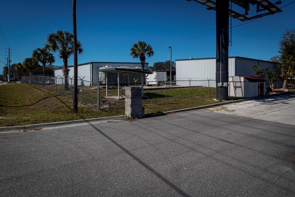 9215 Ridge Road New Port Richey, FL 34654 - Photo 70 of 71 a view of a street with potted plants