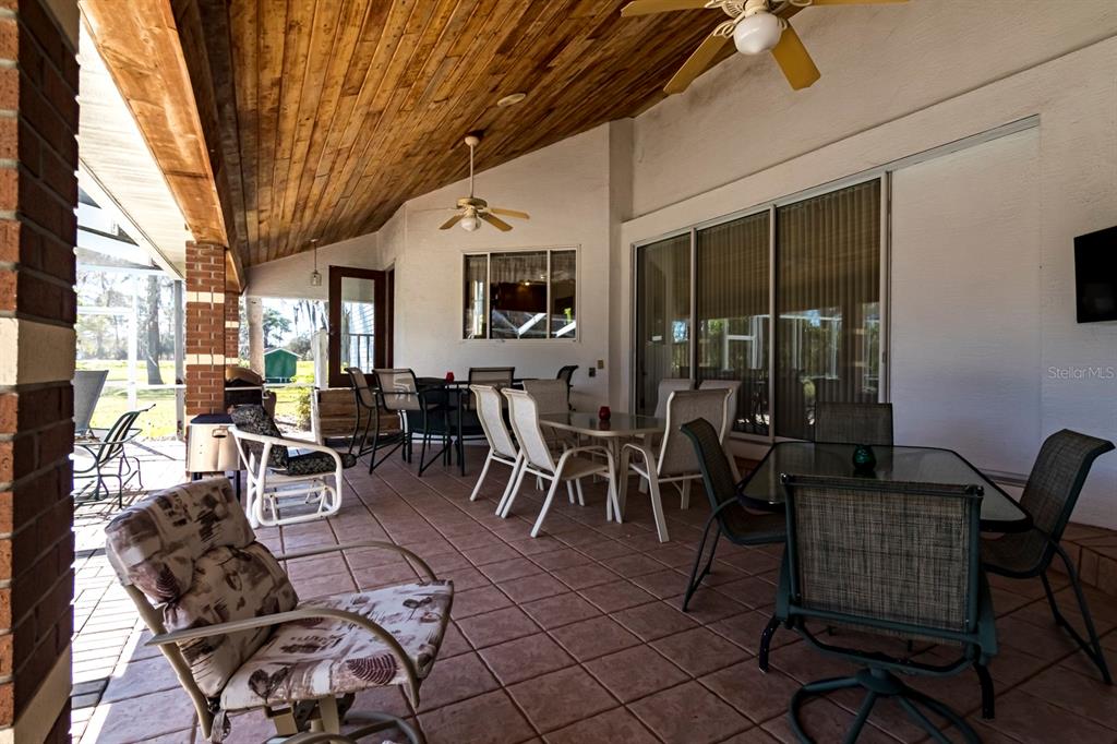 9215 Ridge Road New Port Richey, FL 34654 - Photo 7 of 71 a view of a dining room with furniture window and outside view