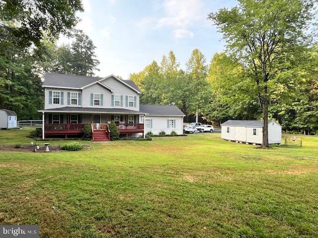 33 Bogey Lane Bumpass, VA 23024 - Photo 2 of 3 a view of a big house with a big yard and large trees