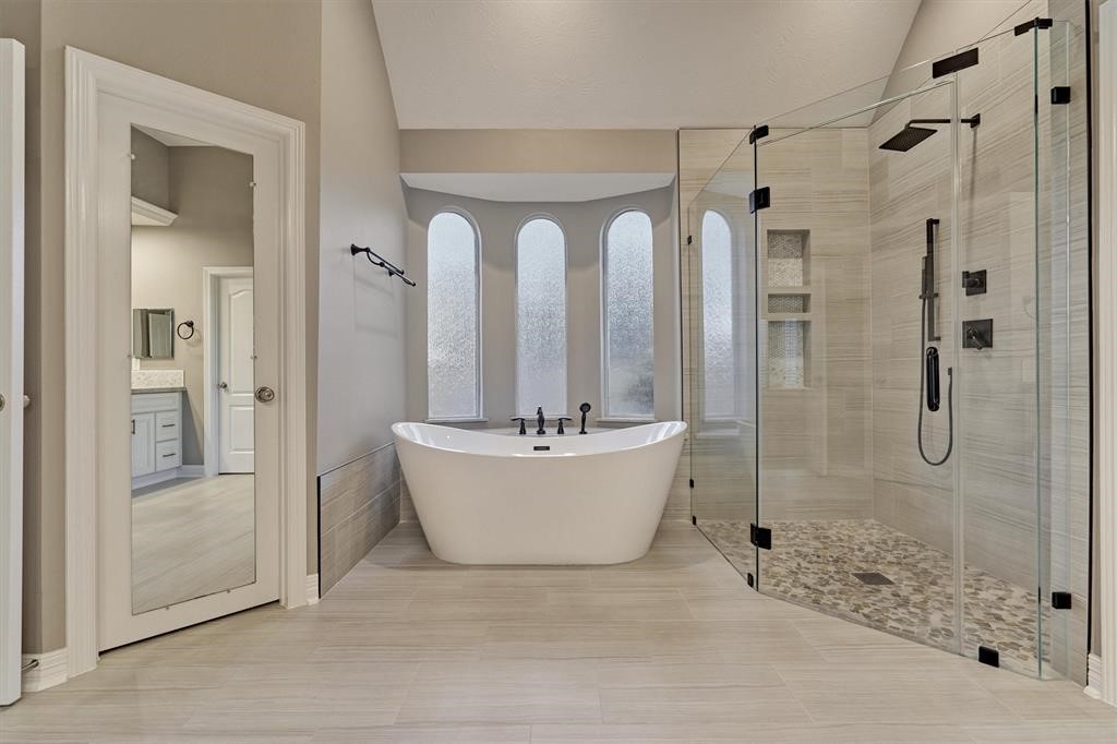 20806 East Cameron Ridge Drive Cypress, TX 77433 - Photo 17 of 45 a bathroom with a bathtub shower and toilet