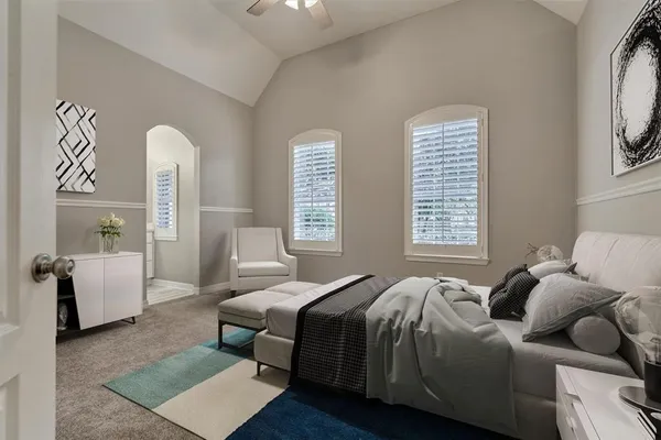 a bedroom with a bed and a couch