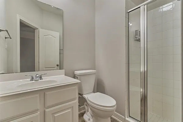 a bathroom with a sink toilet and vanity