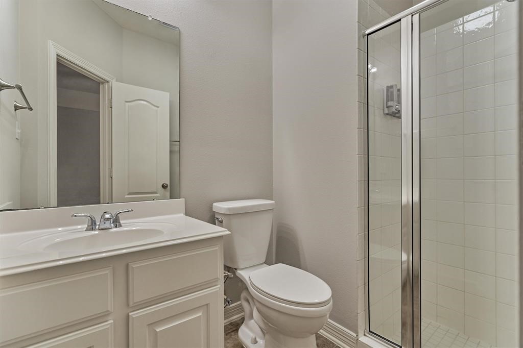 20806 East Cameron Ridge Drive Cypress, TX 77433 - Photo 19 of 45 a bathroom with a sink toilet and vanity