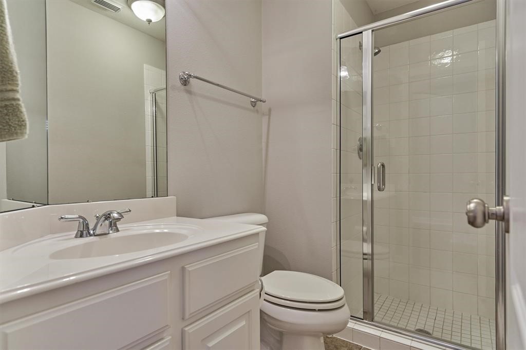 20806 East Cameron Ridge Drive Cypress, TX 77433 - Photo 27 of 45 a bathroom with a sink toilet and shower
