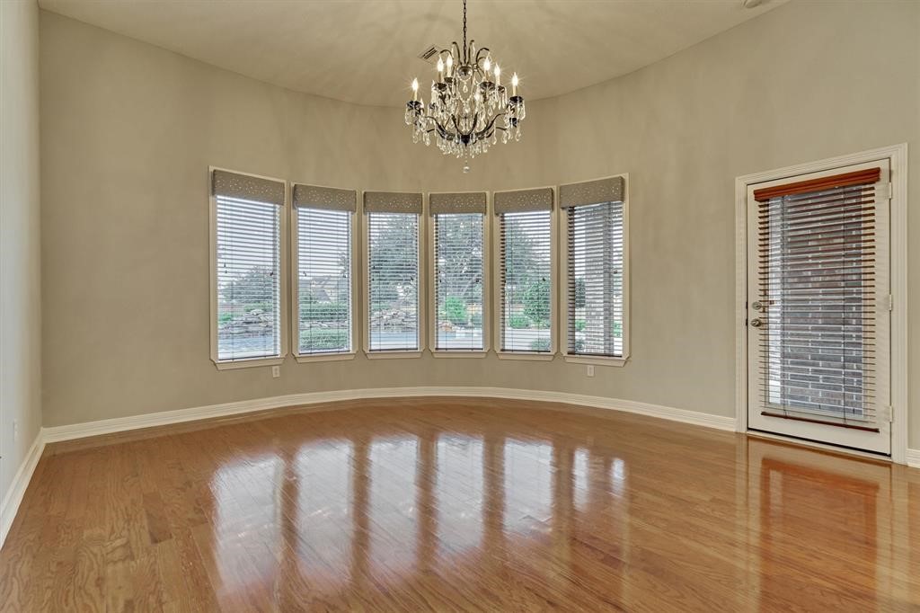 20806 East Cameron Ridge Drive Cypress, TX 77433 - Photo 28 of 45 a view of empty room with wooden floor and fan