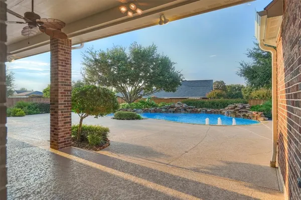 a view of swimming pool with an outdoor space and seating area