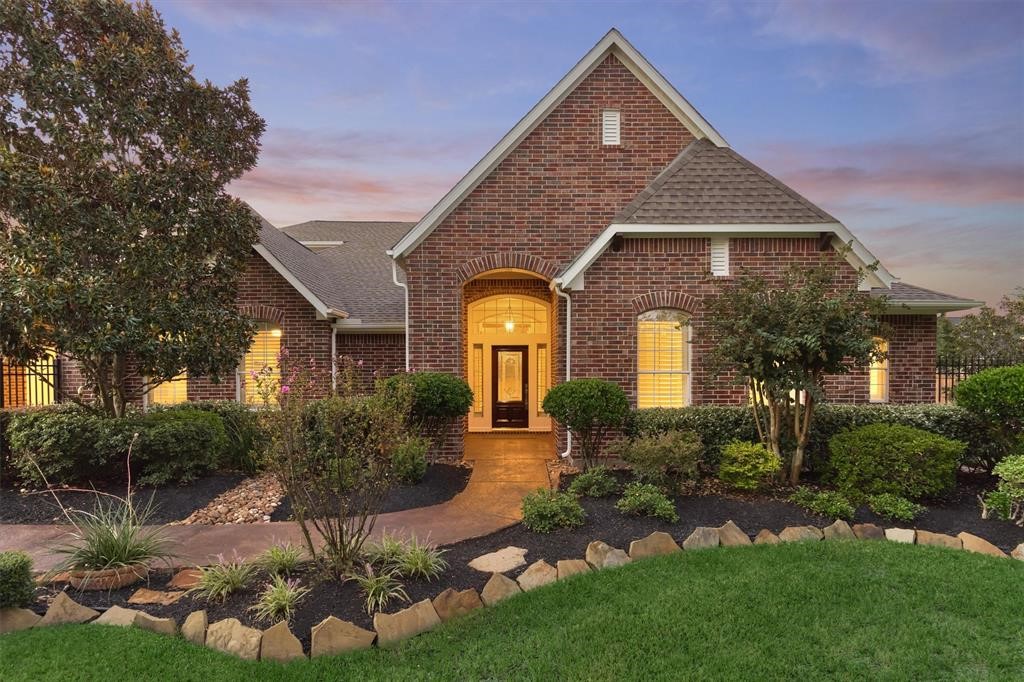 20806 East Cameron Ridge Drive Cypress, TX 77433 - Photo 41 of 45 a front view of a house with a yard