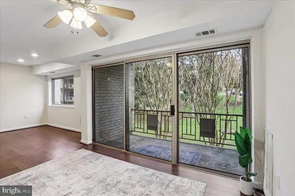a view of livingroom with hardwood floor and a sink