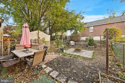 a view of a backyard with sitting area