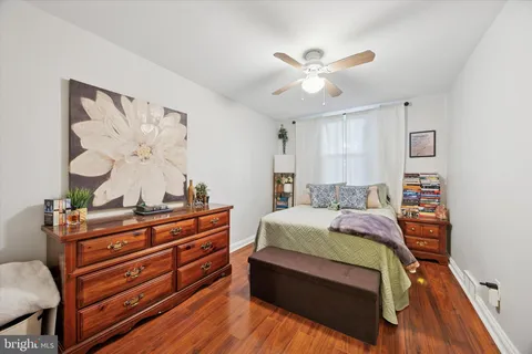 a bed room with a bed and a chandelier
