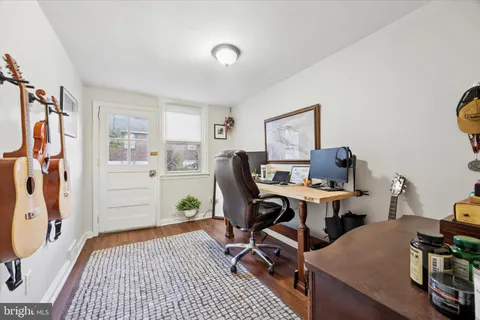 a workspace with furniture and wooden floor