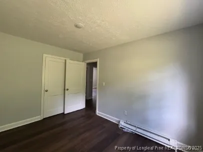 an empty room with wooden floor