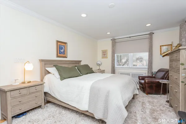 a bedroom with a bed and furniture