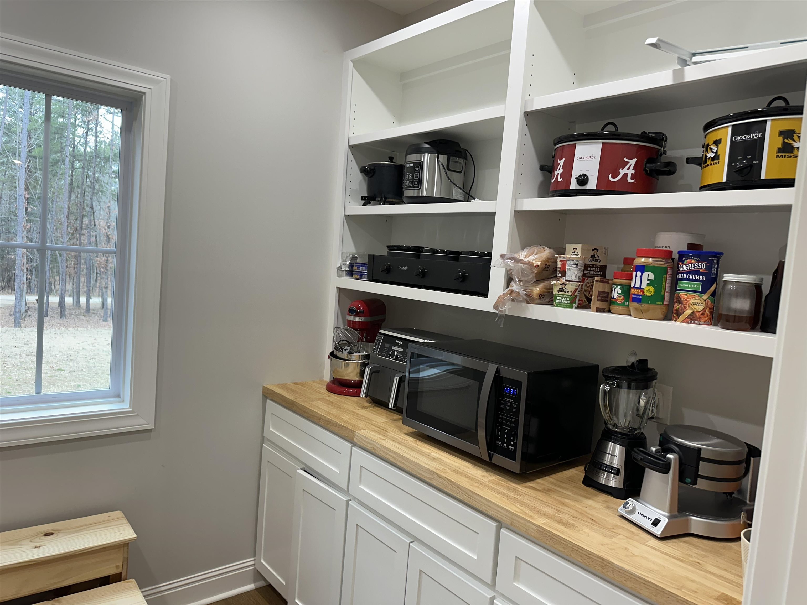 335 Timber Ridge Road Counce, TN 38326 - Photo 12 of 33 Lots of storage space with cabinets and drawers, butcher block counter top in pantry