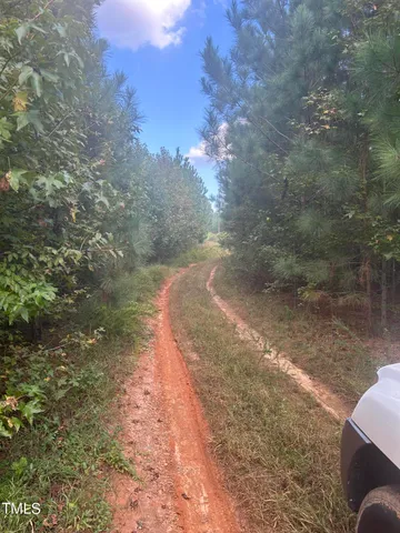 a view of a lake with a yard
