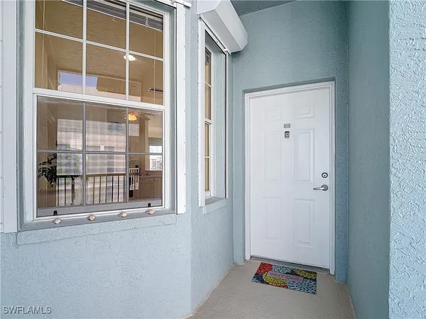 a view of a door and a window