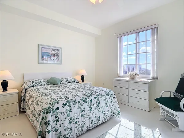 a bedroom that has a bed and a window in it