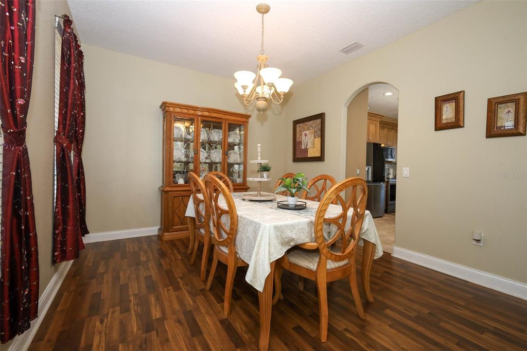 3222 Merrick Avenue Rockledge, FL 32955 - Photo 11 of 73 a view of a dining room with furniture wooden floor and chandelier