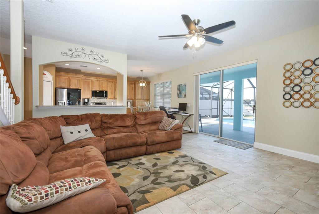 3222 Merrick Avenue Rockledge, FL 32955 - Photo 18 of 73 a view of a livingroom with furniture and a ceiling fan