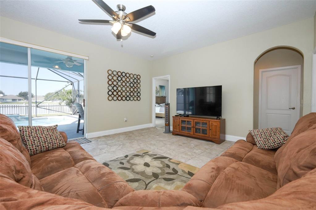 3222 Merrick Avenue Rockledge, FL 32955 - Photo 19 of 73 a living room with furniture and a flat screen tv