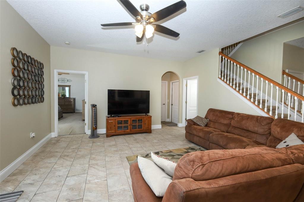 3222 Merrick Avenue Rockledge, FL 32955 - Photo 22 of 73 a living room with furniture and a flat screen tv