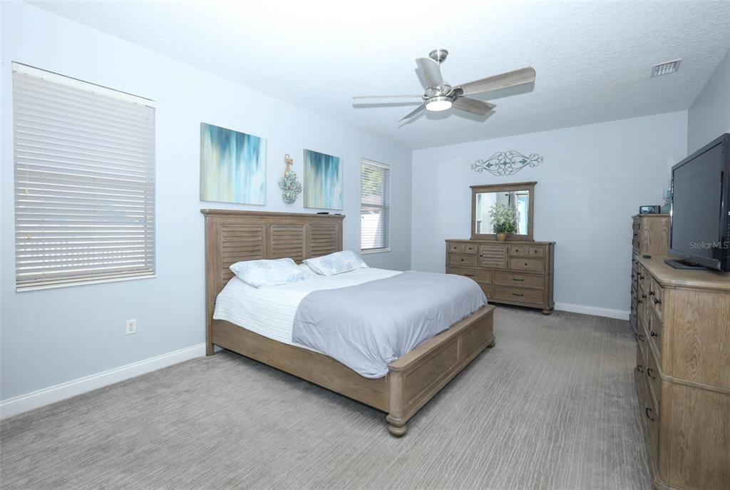 3222 Merrick Avenue Rockledge, FL 32955 - Photo 24 of 73 a bedroom with a bed a window and a television