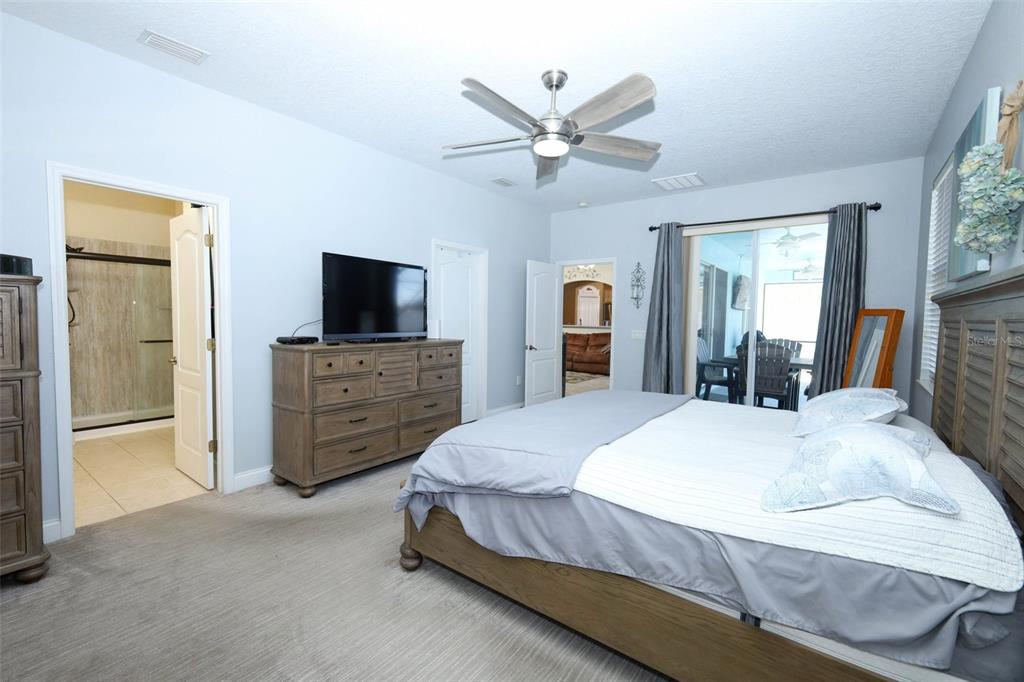 3222 Merrick Avenue Rockledge, FL 32955 - Photo 26 of 73 a bedroom with a bed and a flat screen tv
