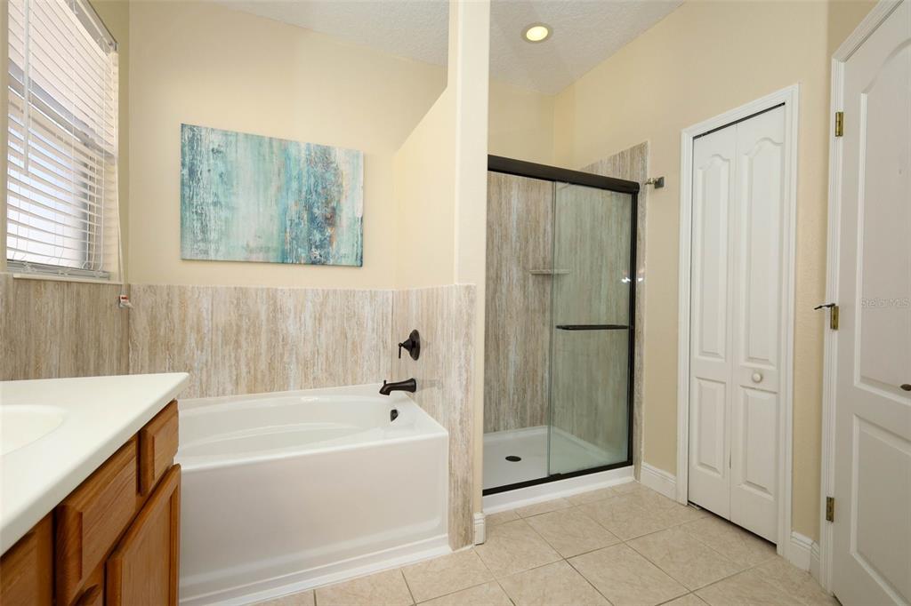 3222 Merrick Avenue Rockledge, FL 32955 - Photo 29 of 73 a bathroom with a bathtub and a shower
