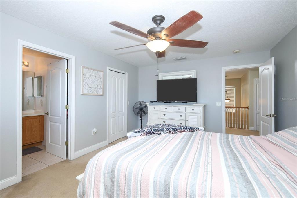3222 Merrick Avenue Rockledge, FL 32955 - Photo 35 of 73 a bedroom with a bed and a chandelier