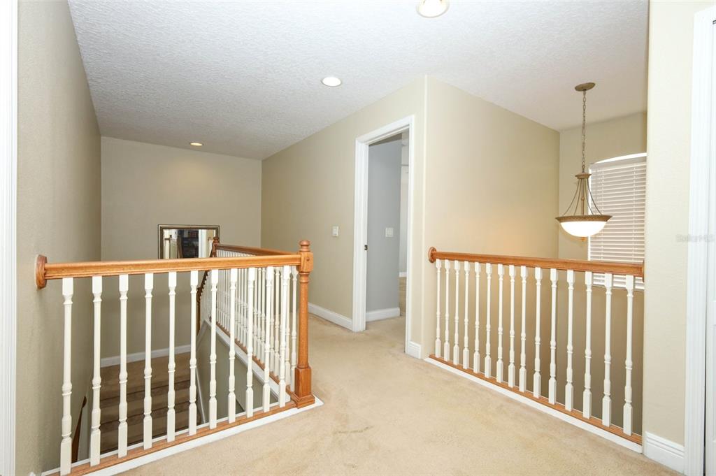 3222 Merrick Avenue Rockledge, FL 32955 - Photo 37 of 73 a view of staircase with railing and a rug