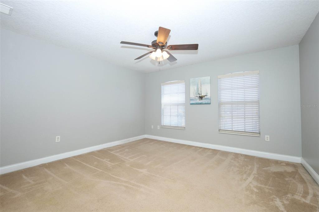 3222 Merrick Avenue Rockledge, FL 32955 - Photo 38 of 73 an empty room with windows and fan