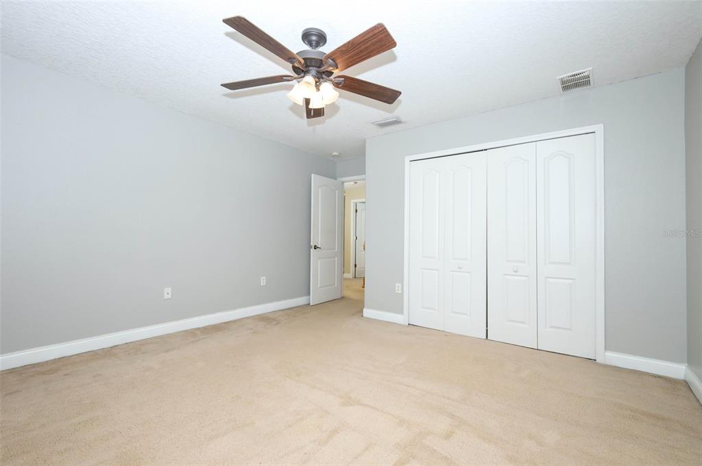 3222 Merrick Avenue Rockledge, FL 32955 - Photo 39 of 73 an empty room with a ceiling fan and a window