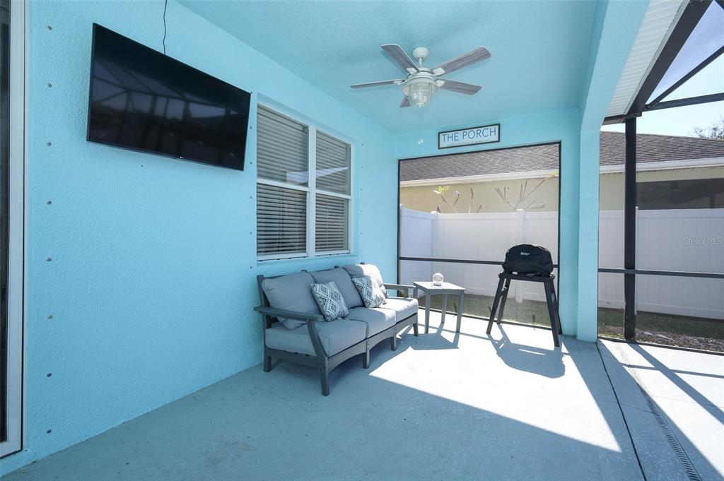 3222 Merrick Avenue Rockledge, FL 32955 - Photo 46 of 73 a living room with furniture and a flat screen tv