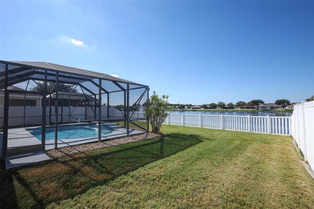 3222 Merrick Avenue Rockledge, FL 32955 - Photo 50 of 73 a view of backyard with staircase and wooden fence