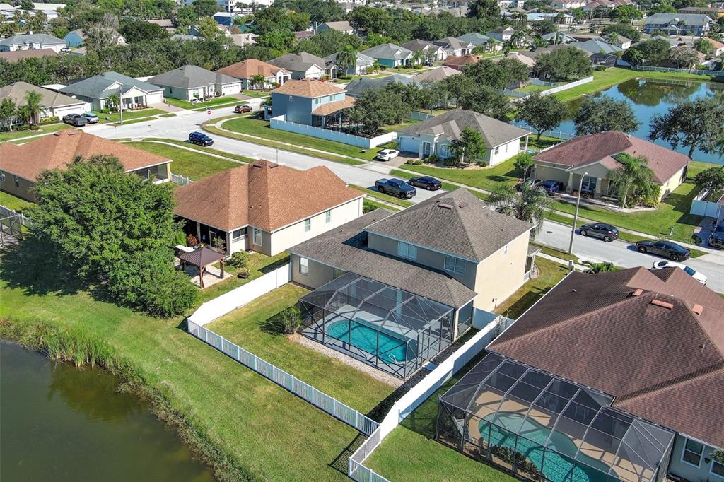 3222 Merrick Avenue Rockledge, FL 32955 - Photo 62 of 73 an aerial view of residential houses with outdoor space and lake view