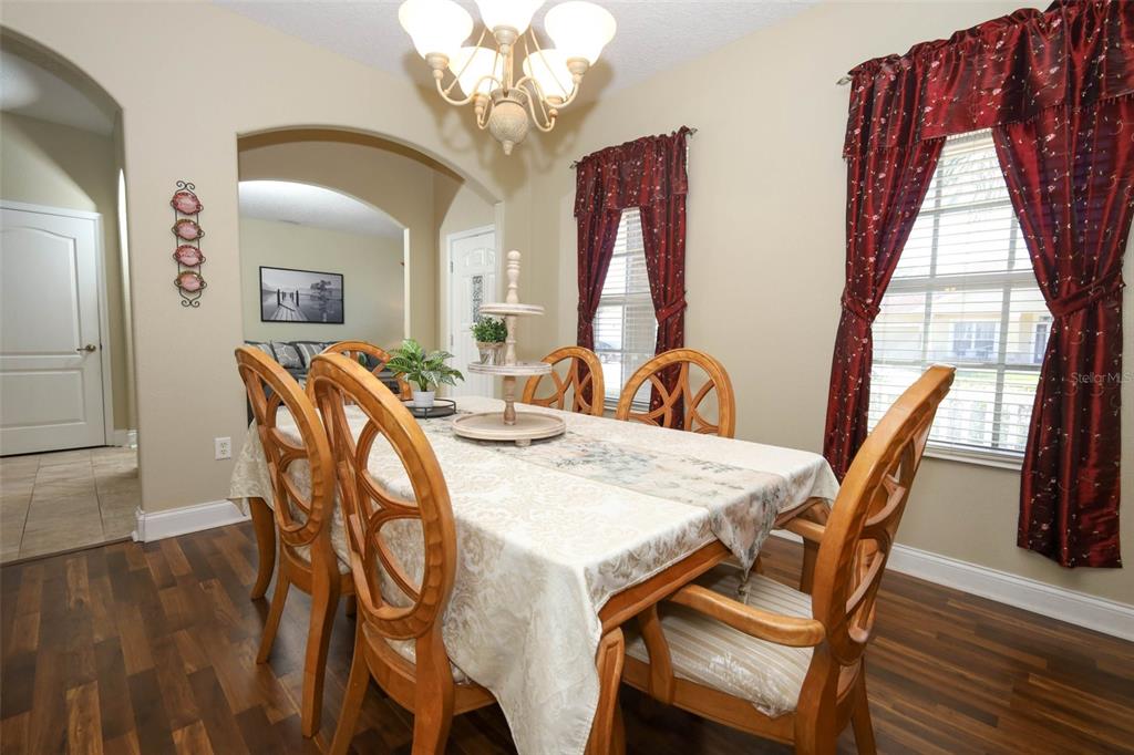 3222 Merrick Avenue Rockledge, FL 32955 - Photo 10 of 73 a view of a dining room with furniture window and wooden floor
