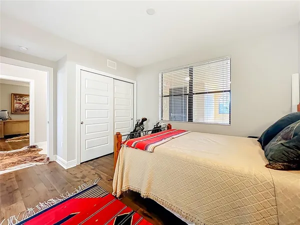 a bed room with a bed and a window