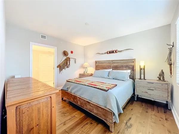 a bedroom with a bed and a dresser