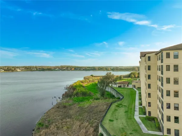 a view of a lake with a big yard