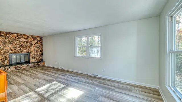 a view of an empty room with a window