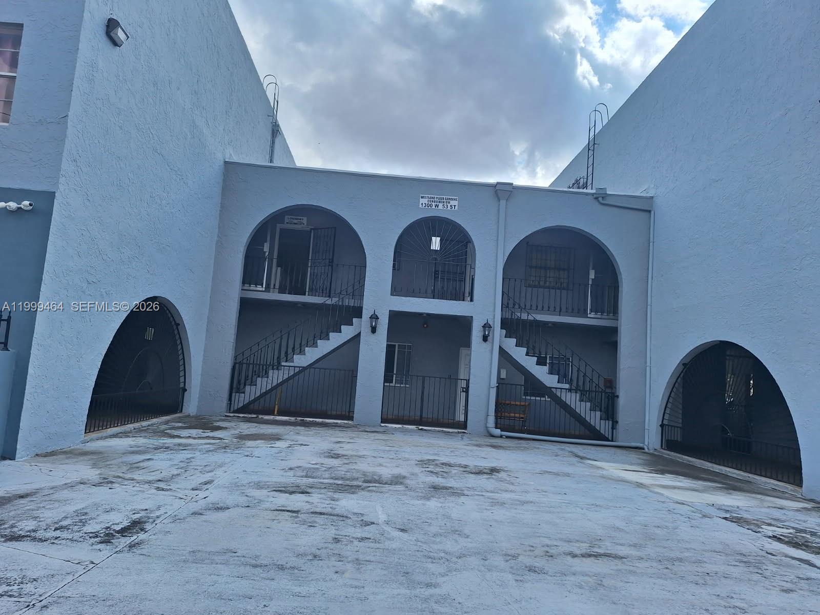 1300 West 53rd Street, Unit 19 Hialeah, FL 33012 - Photo 2 of 7 a view of a livingroom with a staircase