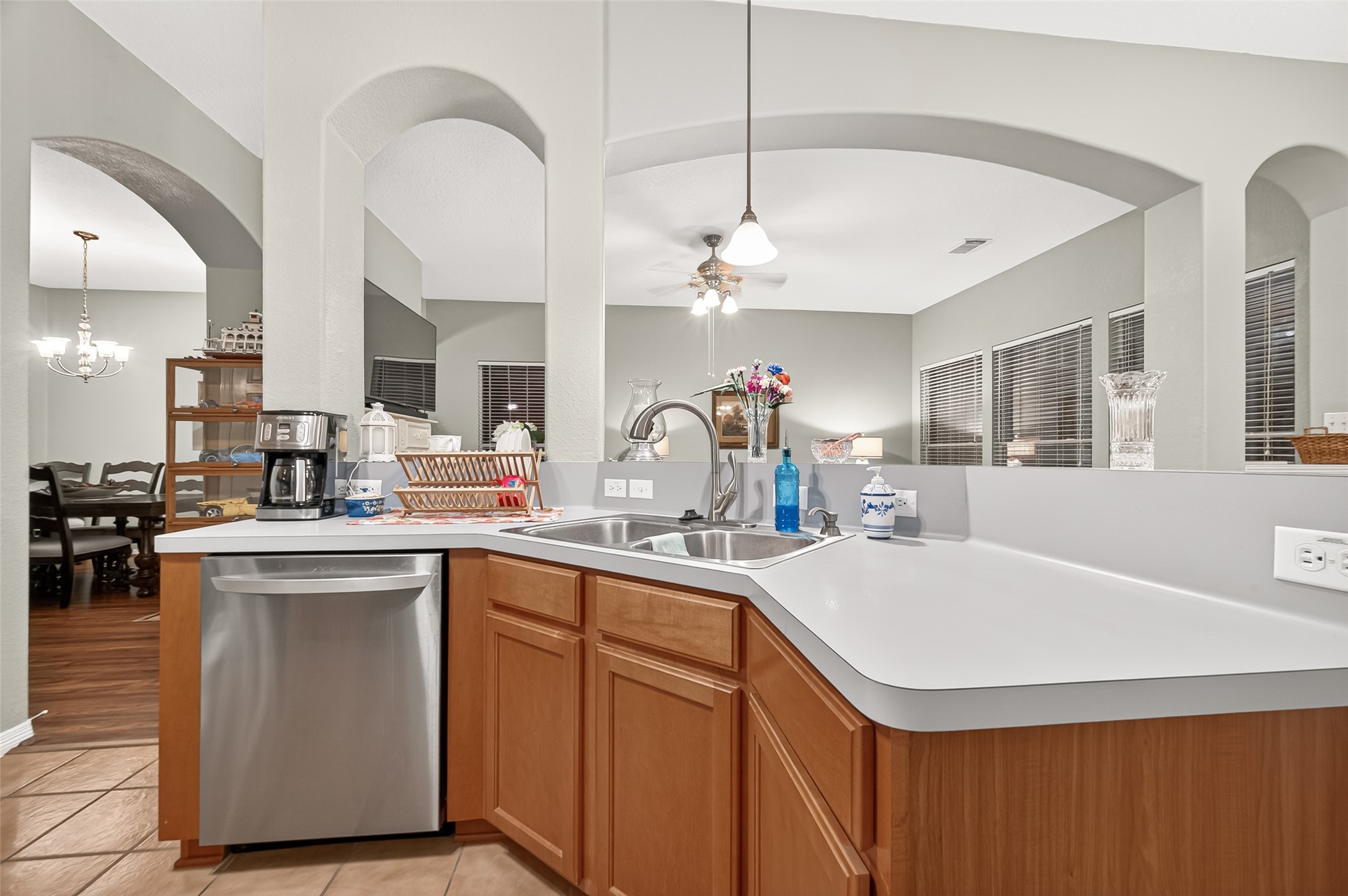 12455 West Summerlin Conroe, TX 77302 - Photo 13 of 31 a kitchen with a sink a stove and chairs